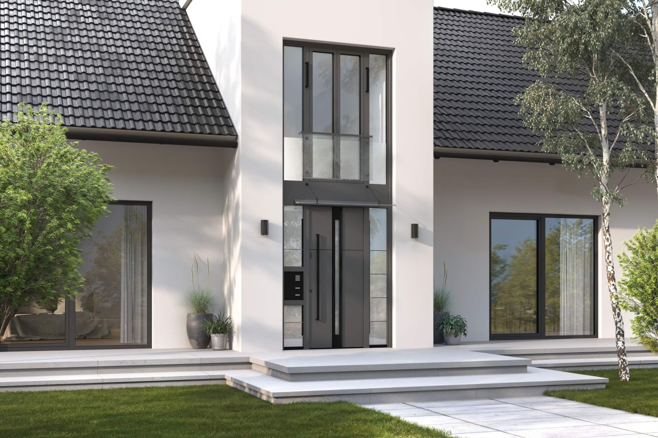 Pročelje hiše z vhodnimi vrati z dvoetažnim steklenim elementom